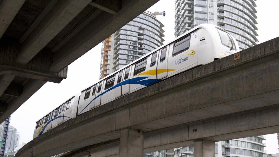 A Skytrain passes near Canada Hockey Place