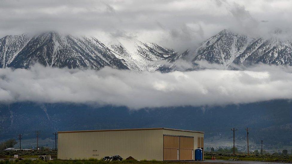 A hangar sits at the base of the Sierra Nevada Mountain Range before the test flight of the Airbus Perlan 2 manned glider May 7, 2016 at Minden-Tahoe Airport in Minden, Nevada