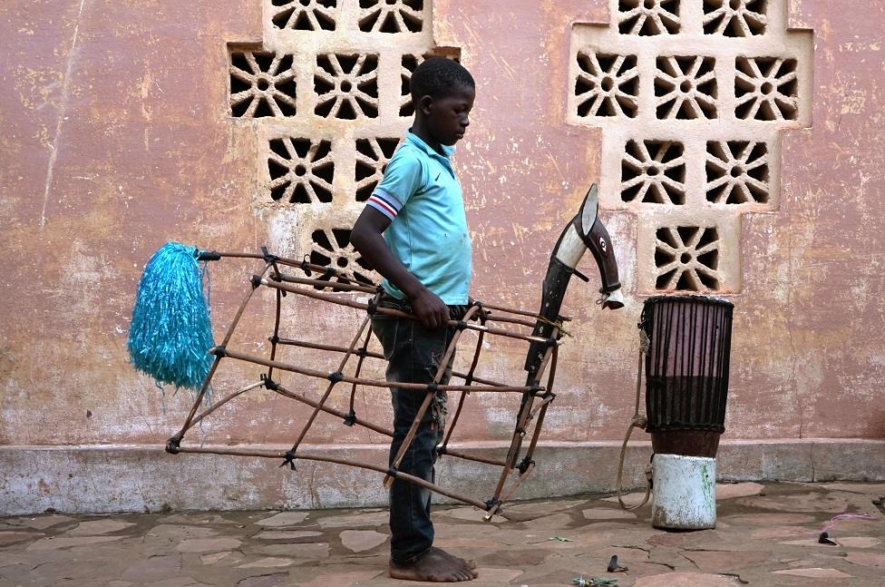 Boy inside the frame of a puppet