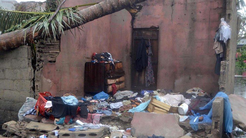 A building home with walls taken out by the cyclone