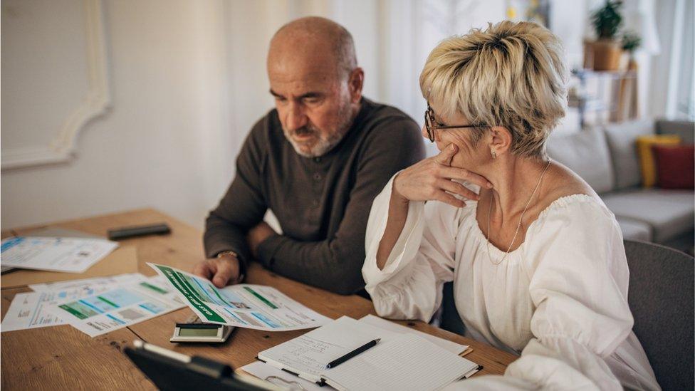 Couple looking at bills