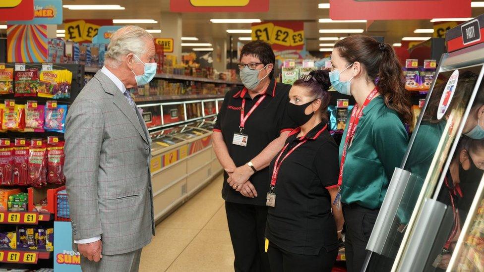 The Prince of Wales talks to staff during a visit to the headquarters of Iceland Foods Ltd, Flintshire