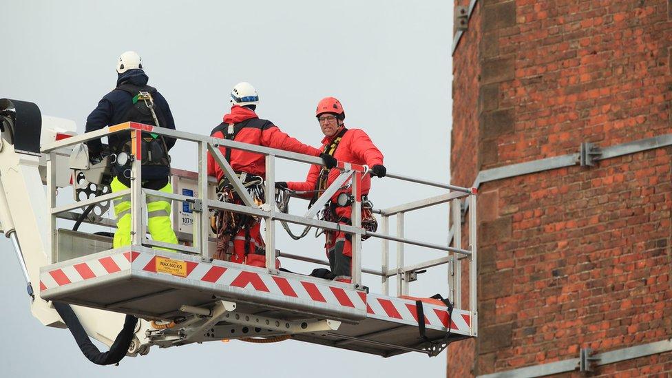 Search and Rescue team members from Lancashire Fire and Rescue Service use a hydraulic platform