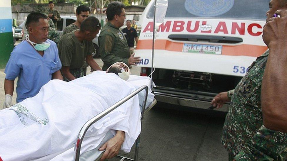 Lorenzo Vinciguerra on a stretcher in the Philippines