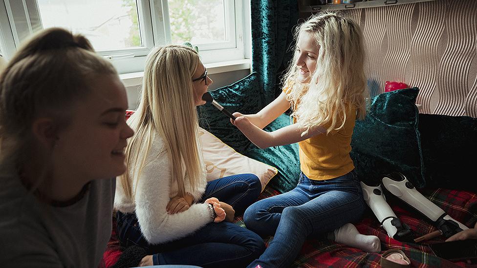 Three girls testing make-up