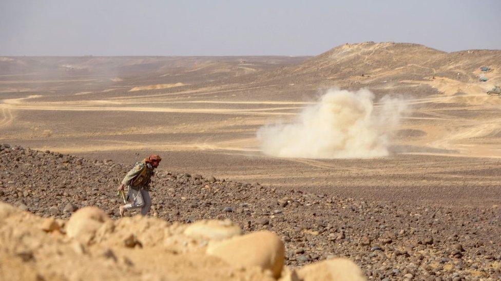 Smoke billows during clashes between forces loyal to Yemen's Saudi-backed government and Houthi rebel fighters in al-Jadaan area about 50 kilometres northwest of Marib in central Yemen on February 11, 2021.