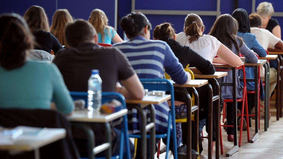 Students sit an exam