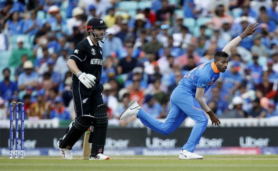 India"s Hardik Pandya (R) bowls during the 2019 Cricket World Cup warm up match between India and New Zealand at The Oval in London on May 25, 2019