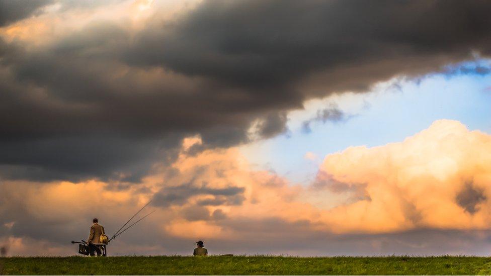 Fishermen use up the last of the evening light at Farmoor Reservoir