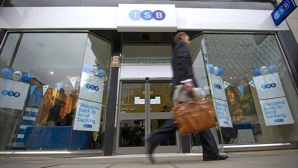 A customer walks past a TSB branch