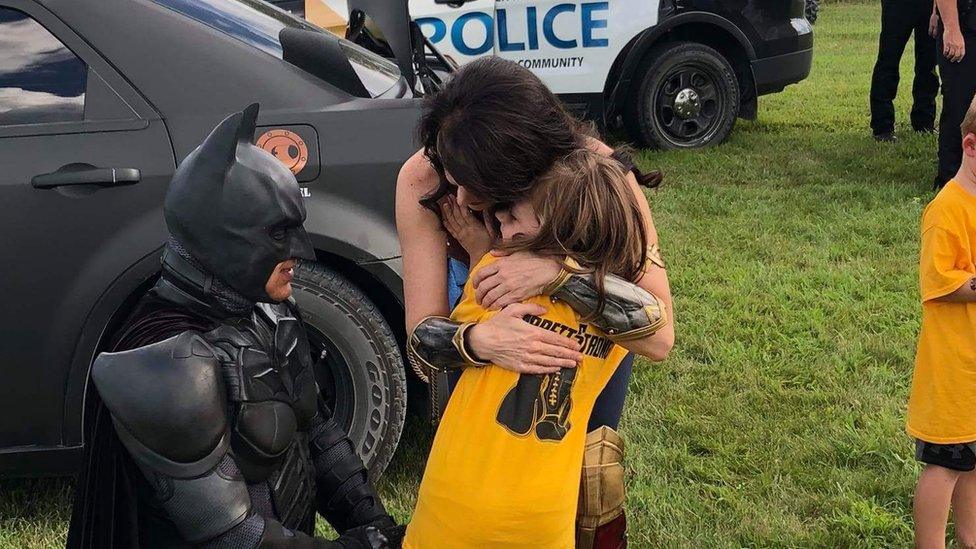 Batman, Wonder Woman and Garrett's sister at the Celebration of Life