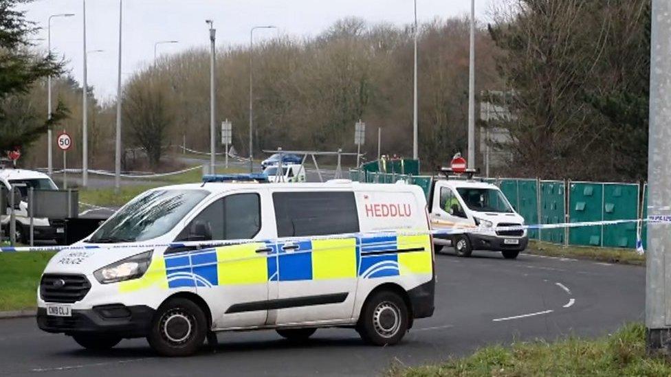 Police van at car crash scene