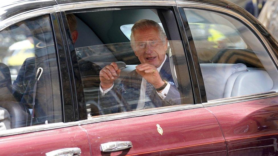 King Charles rides in the back of a car to Buckingham Palace ahead of the Coronation