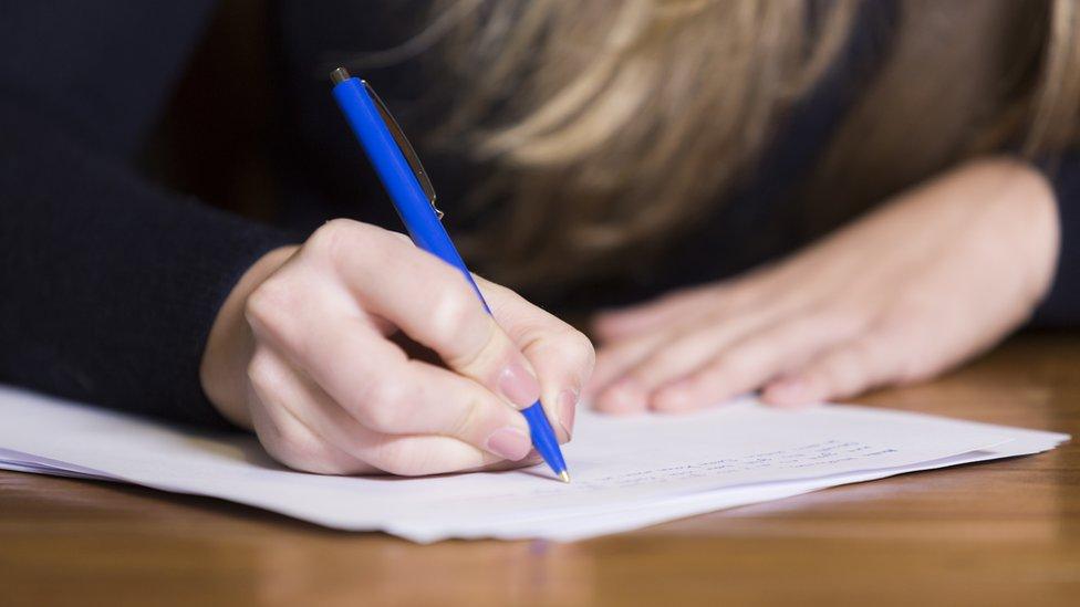 Girl doing an exam paper