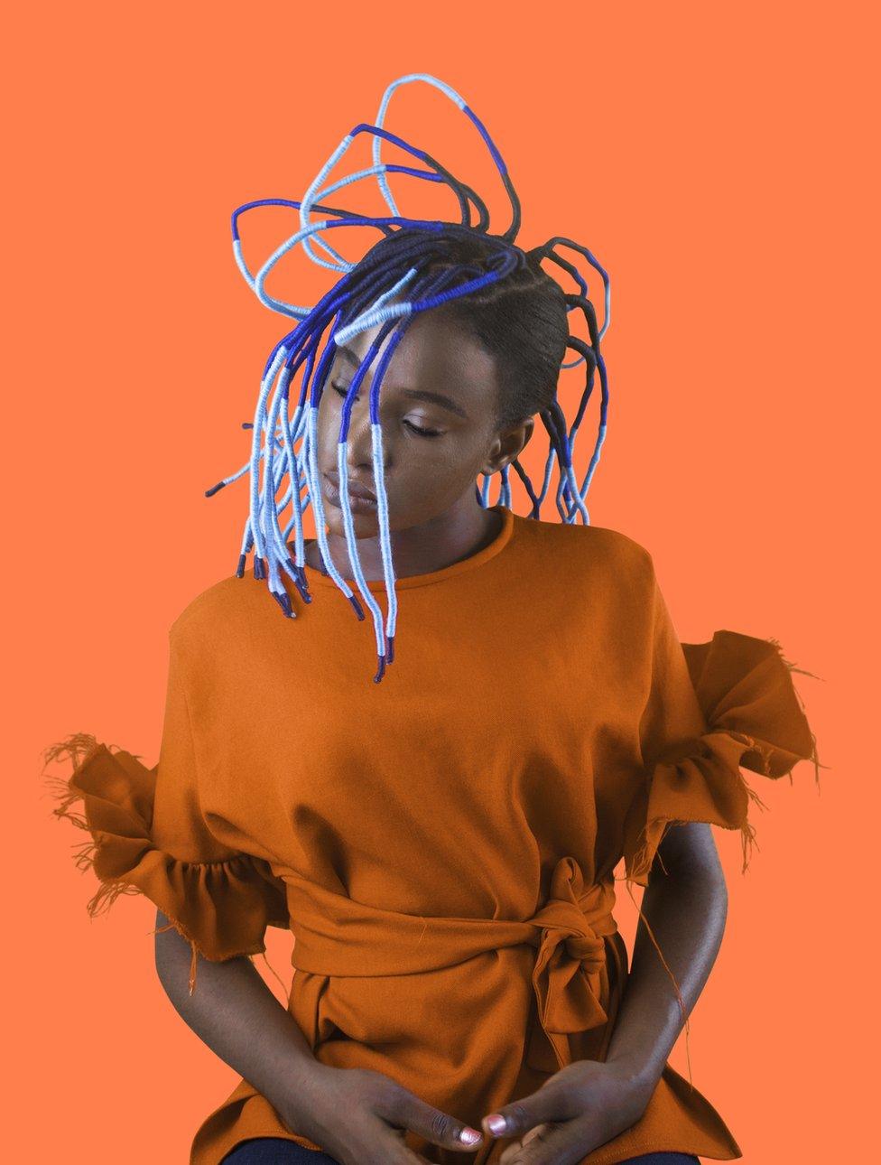 Portrait by Medina Dugger showing African hair braiding