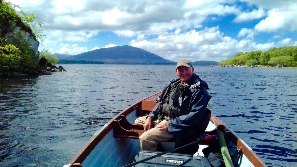 Fly-fisherman in boat