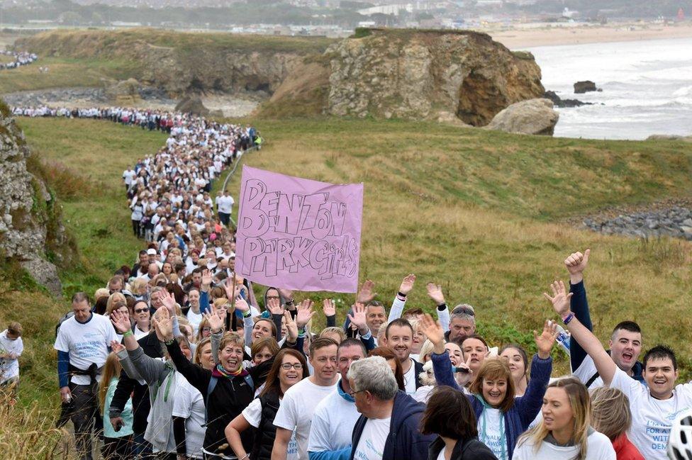 Thousands of walkers make their way along the coastal route