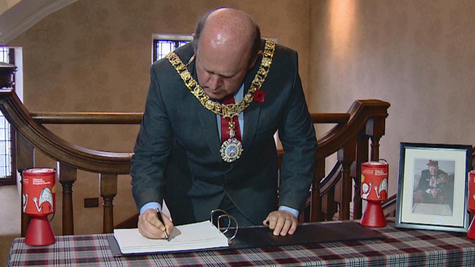 Lord Provost Frank Ross signs the book of condolence