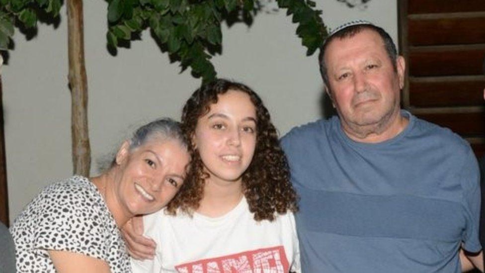 Ori Megidish (C) with family members