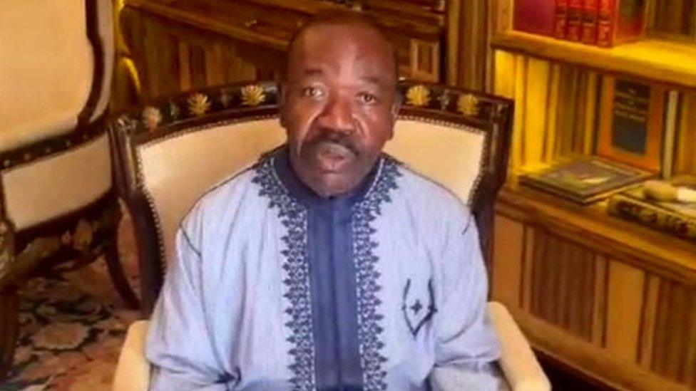 still from video of Ali Bongo