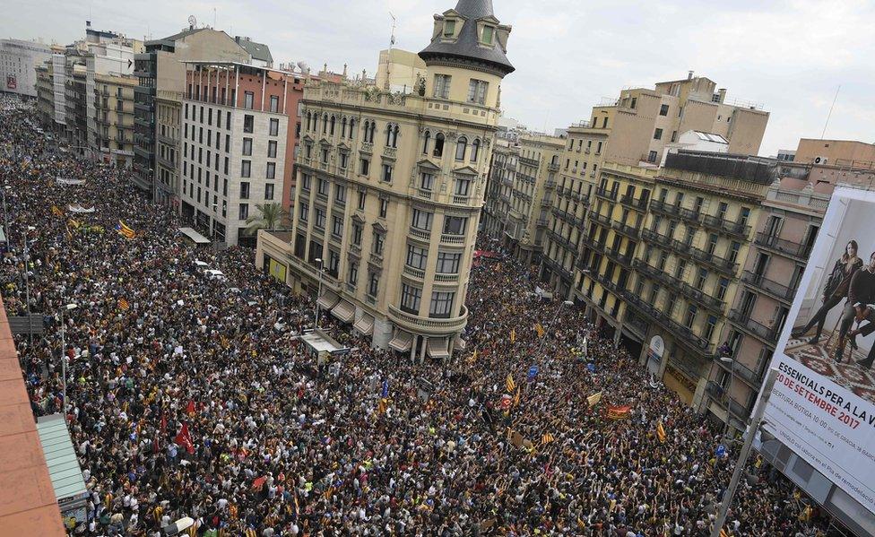 Protesters gather at the Placa de la Universitat square in Barcelona on 3 October