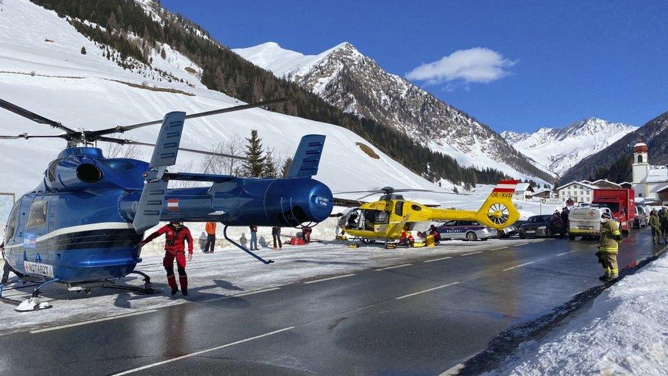 Rescue helicopters stand on a street near the Gammerspitze, in Tyrol, Austria after an avalanche killed a 58-year old man on Saturday.