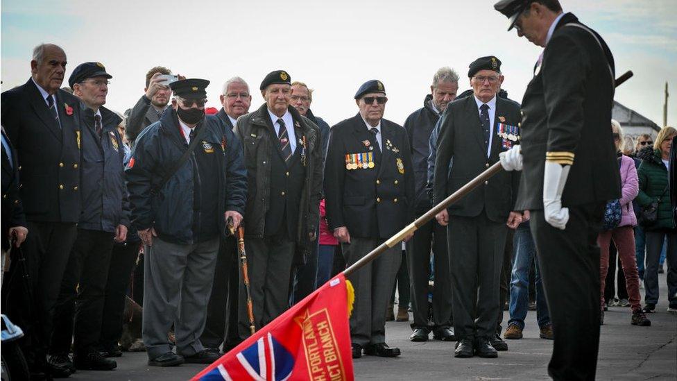 Standard Bearers observe with a two-minute silence at the Weymouth Cenotaph war memorial in Weymouth, England.