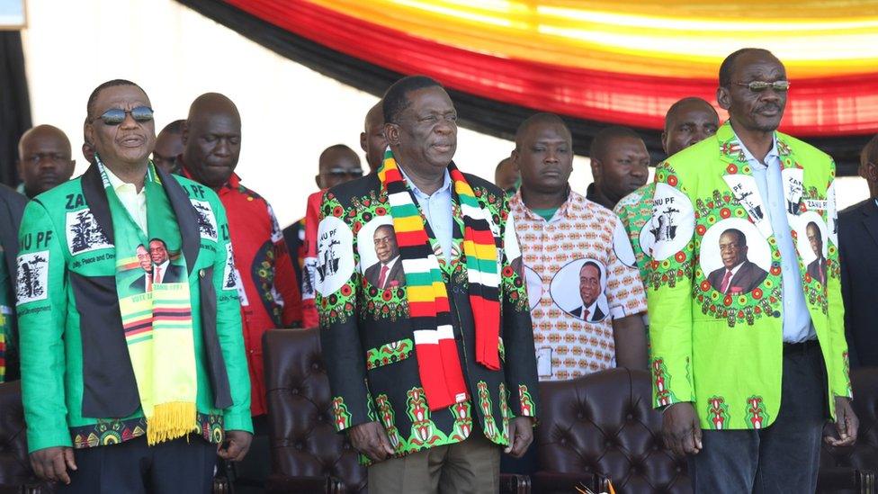 Zimbabwean President Emmerson Mnangagwa (C) before addressing thousands of supporters who had gathered at White City Stadium in Bulawayo, Zimbabwe