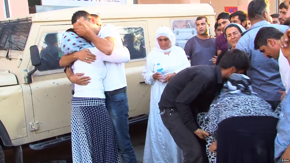 Mourners outside a hospital in Cizre