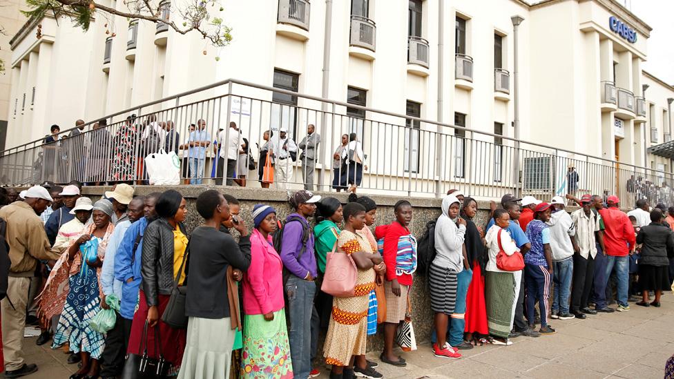 People queue to withdraw money from a bank as Zimbabwe introduces new currency in Harare, Zimbabwe, November 12, 2019