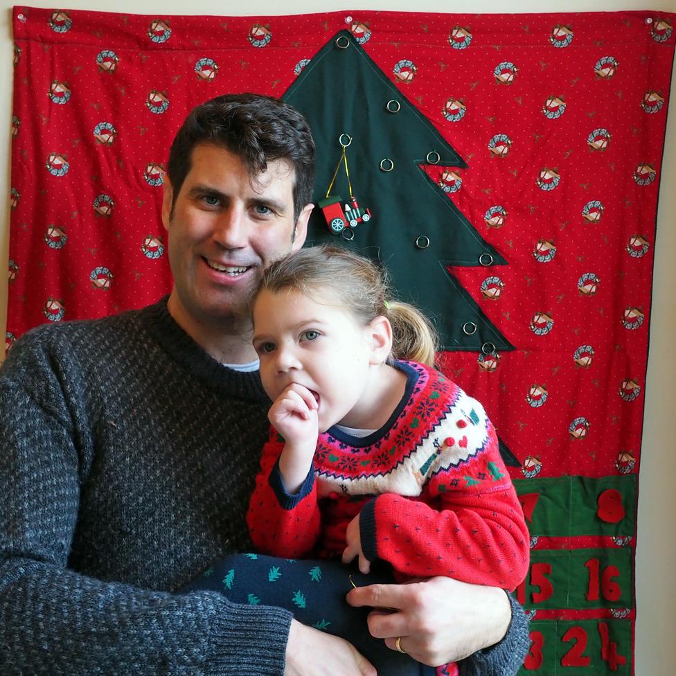 The author and his daughter in front of the advent calendar