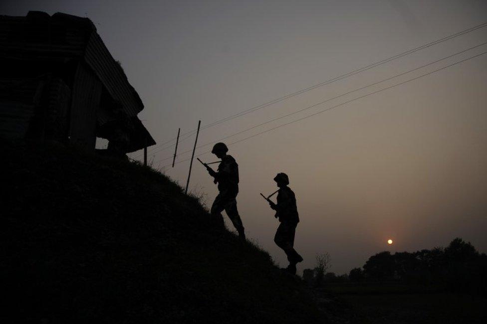 Indian Border Security Force soldiers patrol near the India-Pakistan international border area at Gakhrial boder post in Akhnoor sector, about 48 kilometers from Jammu, India, Saturday, Oct. 1, 2016. In