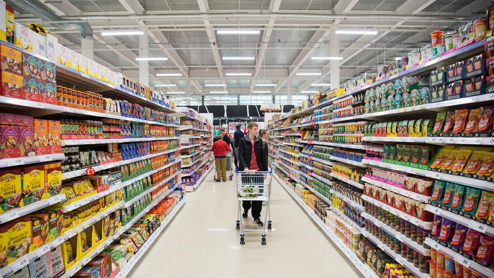 People shopping in the Tesco supermarket superstore, Aberystwyth Wales