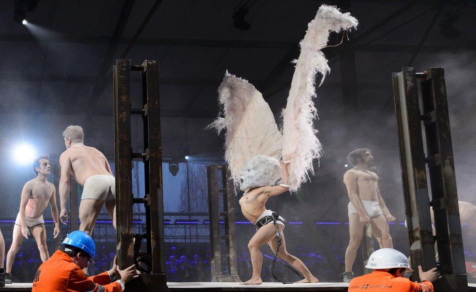 Artists perform during a show on the opening day of the Gotthard rail tunnel