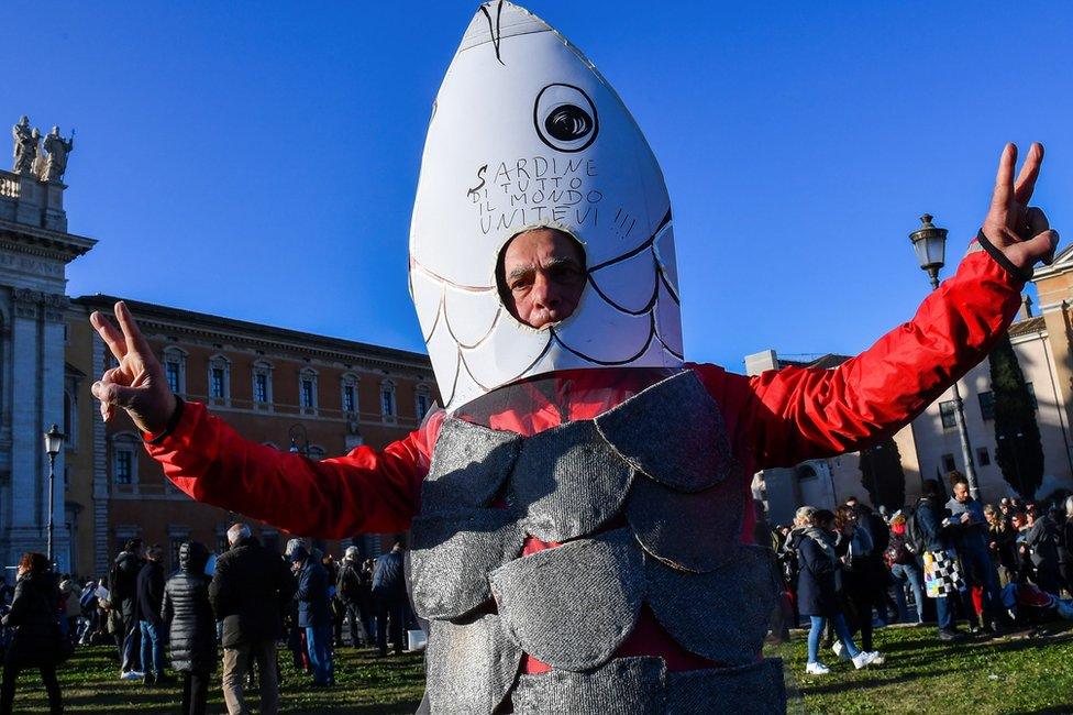 A man takes part in the "Sardine Movement" rally in Rome, 14 December