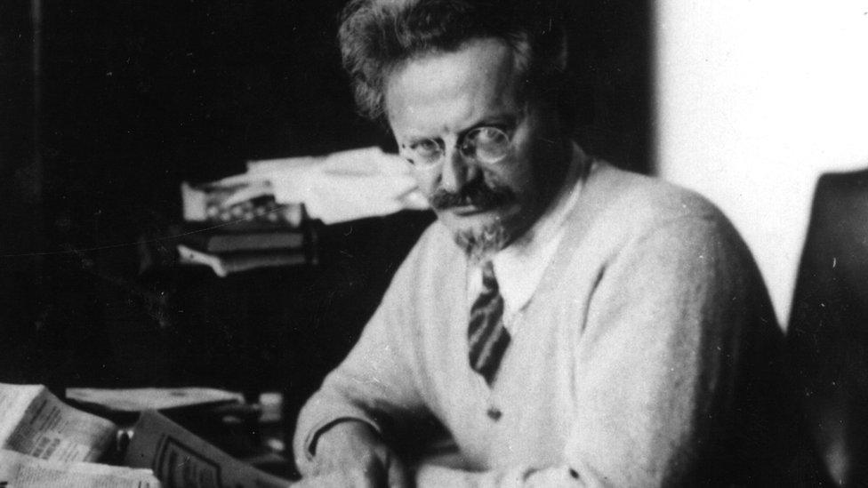 A black and white photograph of Leon Trotsky