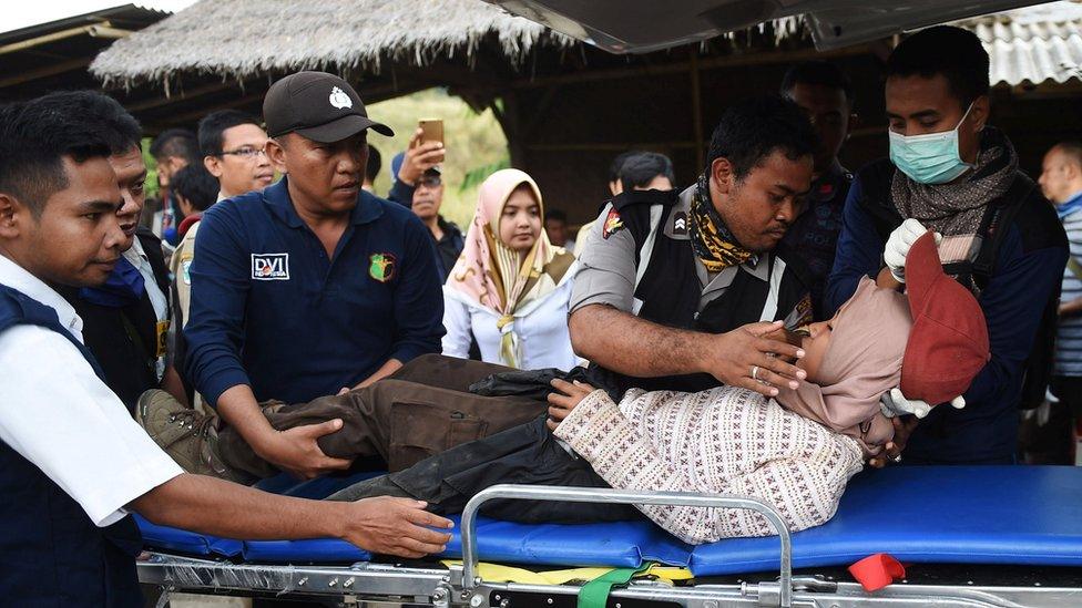 rescuers treat a hiker