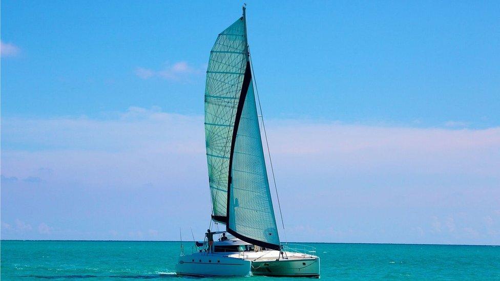 A picture of catamaran Destiny II at sea