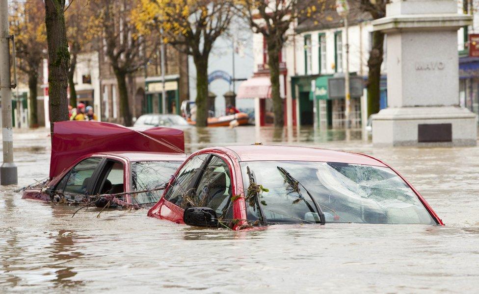 Cars submerged on Cockermouth main street after the River Derwent burst its banks in 2009