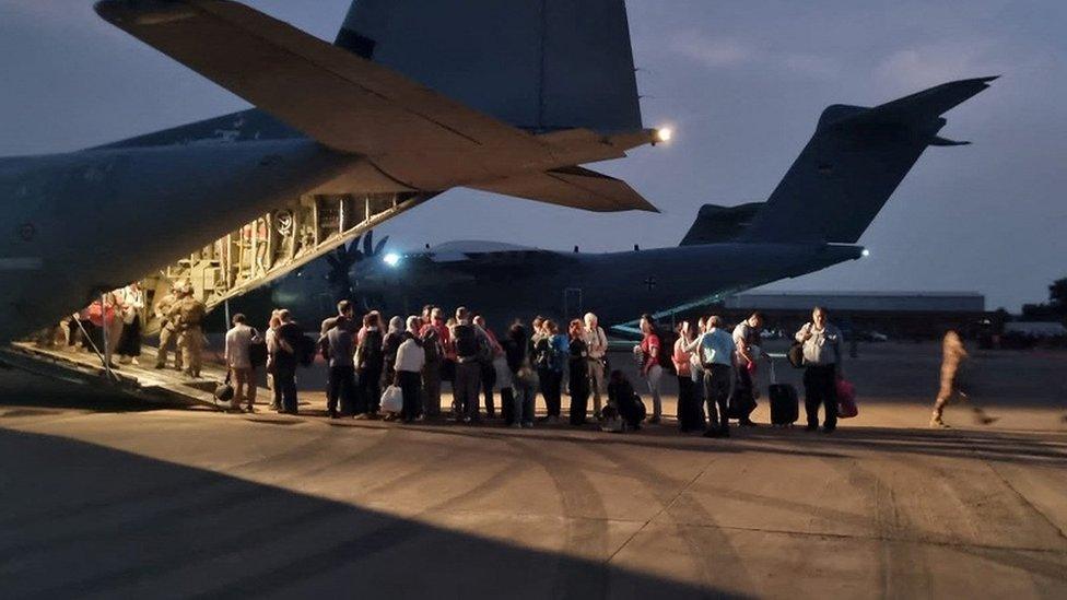 people-about-to-board-plane.