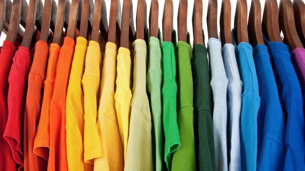 racks of coloured t-shirts