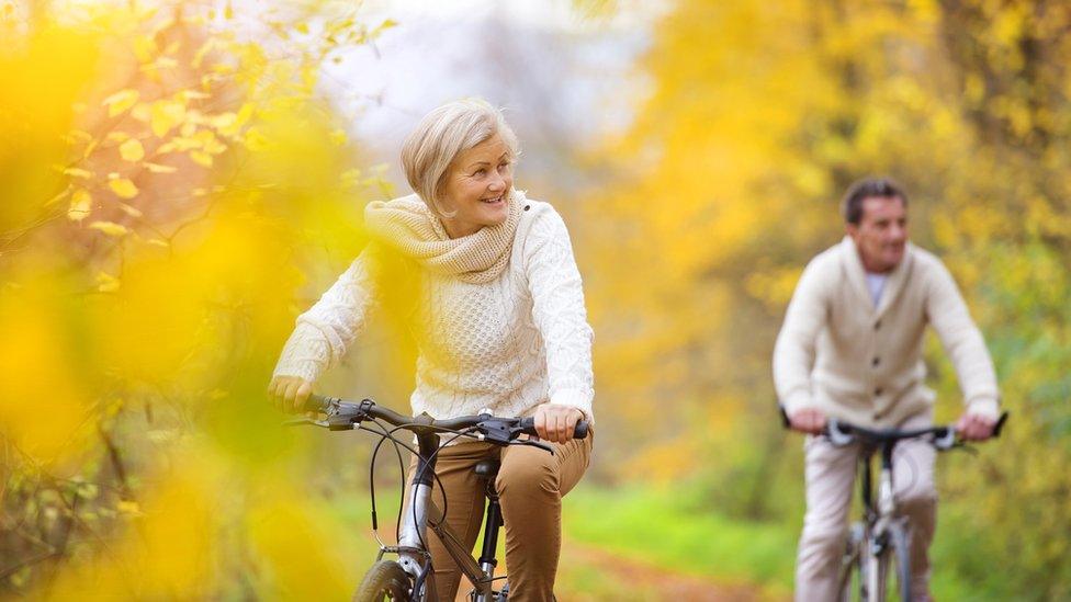 older couple on bikes