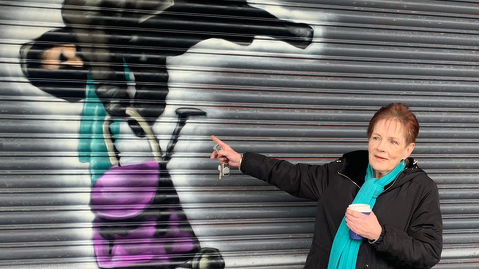 Anne Hughes with her mural