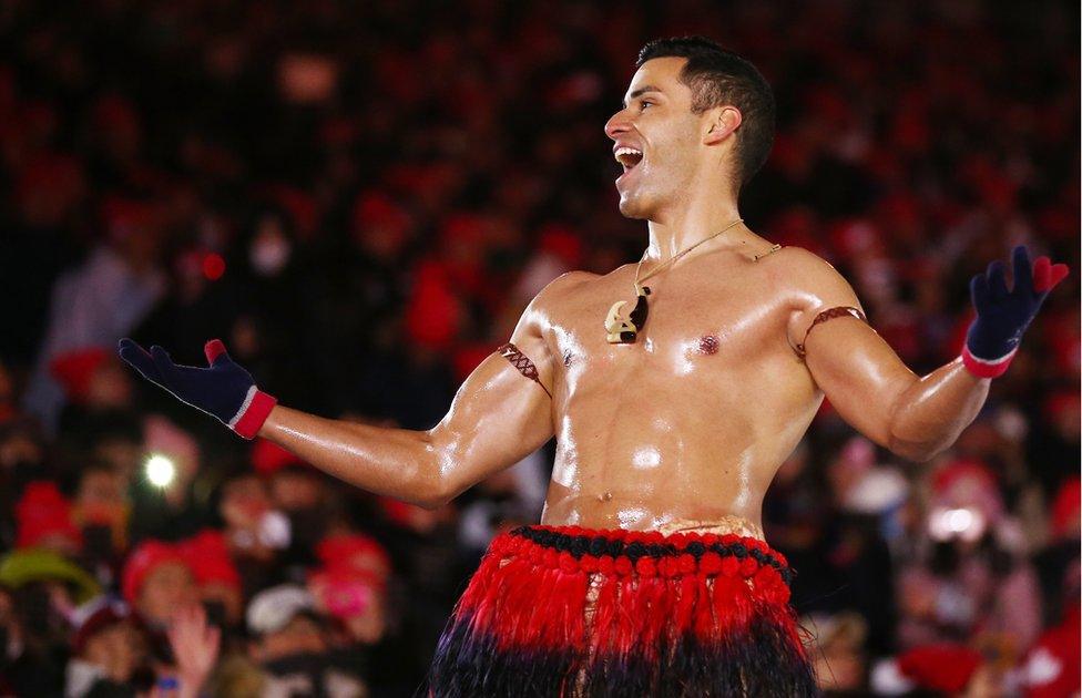 Pita Taufatofua of Tonga stands shirtless