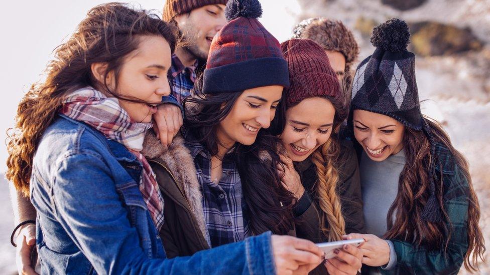 people looking at phone