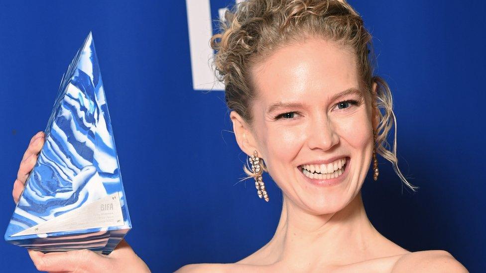 Rosy McEwen holding her best lead performance trophy at the British Independent Film Awards in December