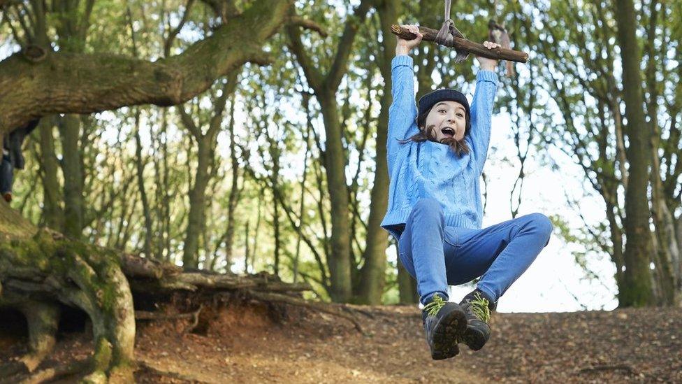 girl on a rope swing