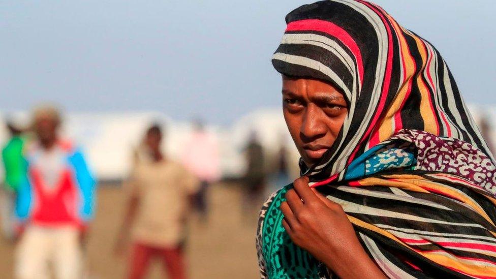 An Ethiopian refugee, who fled the Tigray conflict, walks in the Tenedba camp in Mafaza, eastern Sudan - January 2021