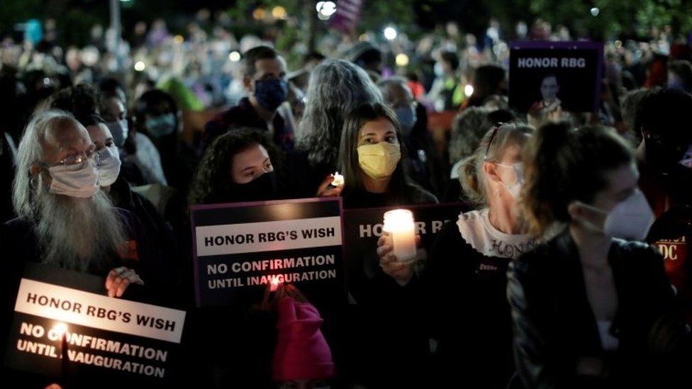 People gather outside the US Supreme Court for a vigil following the death of Ginsburg