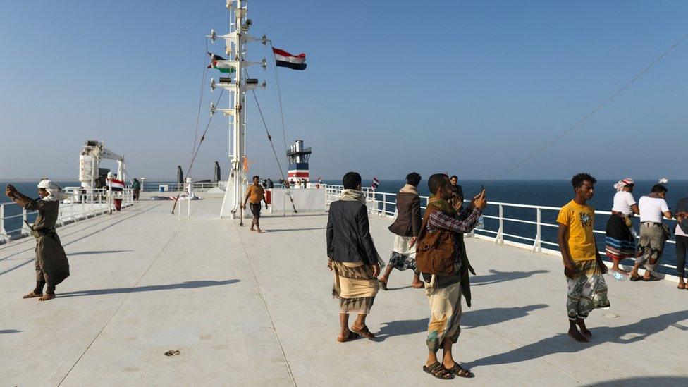 People on the deck of the Galaxy Leader commercial ship, seized by Yemen's Houthis last month, off the coast of al-Salif, Yemen December 5, 2023.